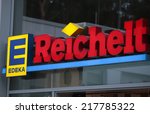 Small photo of CIRCA AUGUST 2014 - BERLIN: the logo of the brands "Edeka" and "Reichelt", Berlin.