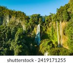 Small photo of Aerial View Numerous waterfalls flow from wide, steep cliffs. Thi Lor Su waterfall Nestled amidst the untouched beauty of Tak Province. Thi Lo Su Waterfall The Largest Waterfall in Thailand.
