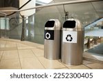 Small photo of Trash can in a shopping mall, cleaning up a recycling concept (trash bin)