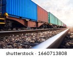 Train wagons carrying cargo containers for shipping companies. Distribution and freight transportation using railroads.