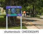 Small photo of Madison, Wisconsin, USA - Aug 1 2023: A sign for the "Planet Trek" featuring Mercury along the Capital City Recreational Trail near Monona Terrace in Madison, WI.
