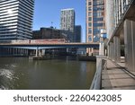 Small photo of Canary Wharf, London, UK, February, 8, 2023, A Docklands Light Railway train arriving at Heron Quay DLR, station.