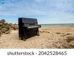 A Lonely Old Black Piano On The ...