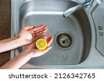 Lemon, salt, kitchen unit, kitchen sink and cleaning kitchen. Natural and eco-friendly cleaning products for cleaning and unclog a kitchen sink
