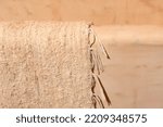 Small photo of textile detail of carpet in construction bathtub, saddlebag