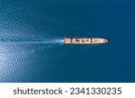 Top view Container ship full capacity approaching  port International Container ship loading, unloading at sea port, Freight Transportation, Shipping,Logistics, import export, Transportation. Globa