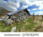 Old and abandoned building on a farm high in the mountains of Norway near Jotunheimen