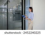 Business woman holding a...
