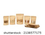 Small photo of Group of Brown Kraft Stand Up Paper Pouch Bags Reusable Zip Lock With Rectangle Transparent Window on white background. Almonds in packaging. Cashew nuts in bag