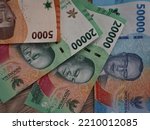 The latest series of Indonesian rupiah banknotes published in 2022, the background of the rupiah currency with a value of fifty thousand, twenty thousand and five thousand rupiah