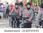 Small photo of Policewomen riding bicycles escort the Cap Go Meh celebration in Singkawang, West Kalimantan, Indonesia on 11 February 2017.