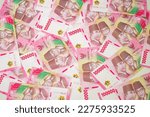 Small photo of Indonesian rupiah banknotes series with the value of one hundred thousand rupiah IDR 100.000 issued since 2004, Indonesian rupiah for background