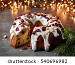 christmas cake with fruits and nuts on grey table