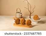 Small photo of Moon Cake Mid Autumn Festival with teapot ,chinese style photograph,landscape format