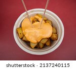 Small photo of Typical serving in spanish bars of patatas bravas with spicy tomato sauce