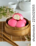 Small photo of Pink steamed bun. The traditional chinese steamed cake " Mi ku" is an importat cake during praying ceremonies as offerings to Chinese Gods. Selective focus.