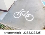 Small photo of Road sign bicycle path on the road,Traffic sign for exclusive lane for bicycles in the city,bicycle sign on asphalt,Bicycle path, road marking element with graphic bicycle sign,Space for text.