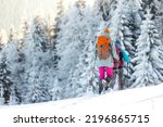 Small photo of Two women walk in snowshoes in the snow, winter trekking, two people in the mountains in winter, hiking equipment