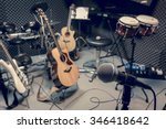 selective focus microphone and blur musical equipment guitar ,bass, drum piano background.