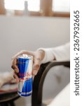 Small photo of KYIV, UKRAINE - JULY 04, 2023 :Red Bull is an energy drink sold by Austrian company Red Bull GmbH, created in 1987. Red Bull is the most popular energy drink in the world.