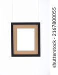 Small photo of Objects Tableau Frame with Sand Background Hung on White Wall
