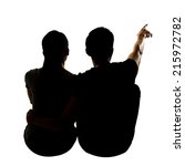 Silhouette Of Couple Sit On...
