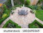 circular garden patio with freshly jet washed paving stones