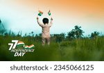 Small photo of 77th Happy Independence day banner design, Cute little boy walking through field with India flag, New and creative Independence day image