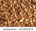 Organic homemade Granola Cereal with oats and almond. Texture oatmeal granola or muesli as background. Top view or flat-lay. Copy space for text.