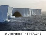 Waves breaking on gigantic tabular iceberg in the Drake Passage near Antarctica (two miles long, probably broke off from the Ross Ice Sheet)