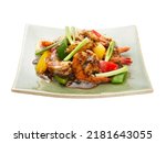 Stir fried prawns with black pepper corn with beel pepper and spring onion. 45 degree angle.  Isolated on whie background.