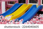 Small photo of Children slider and a ball pool at indoor playground allow kids doing sports Exercises or physical education and also entertain actvity.