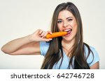 Smiling Woman Bites Carrot....