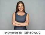 Isolated portrait of smiling  business woman with crossed arms.