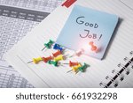 Small photo of Good job text on apper note at office