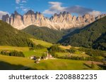 St. Magdalena village with famous church in Val di Funes at sunset, Dolomites , Italy