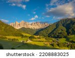 St. Magdalena village with famous church in Val di Funes at sunset, Dolomites , Italy