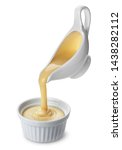 Small photo of Pouring condensed milk isolated on white background with clipping path