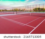 New outdoor red tennis courts with white lines and gray pickleball lines.	