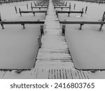 Small photo of Winter aerial photo of frozen, snowy marina, docks at Allan H Treman State Marine Park, Ithaca, NY, USA. 01-21-2024