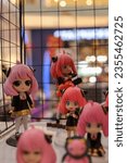 Small photo of Yogyakarta, August 27, 2023 : Embracing my inner spy with Anya Forger from Spy x Family. Pink-haired perfection in action figure form.