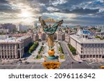 Small photo of Kyiv, Ukraine. July 10, 2021. Aerial view of the Kyiv Ukraine above Maidan Nezalezhnosti Independence Monument. Golden beautiful Ukrainian woman statue in the middle of the city.