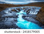 Bruarfoss (Bridge Fall), is a waterfall on the river Bruara, in southern Iceland where a series of small runlets of water runs into a beautiful, turquoise-blue colored pool