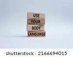 Use your Body Language symbol. Concept words Use your Body Language on wooden blocks. Beautiful white background. Business and Use your Body Language concept. Copy space