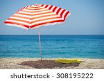 Striped Beach Umbrella On The...