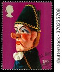 Small photo of UNITED KINGDOM - CIRCA 2001: A used postage stamp printed in Britain celebrating Traditional Seaside Punch and Judy Show Puppets showing Beadle Puppet