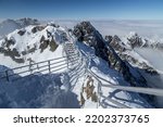 Snowy walkway across High Tatra Mountain ridge in winter, Lomnicky Peak Stit, Slovakia