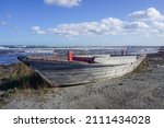 Wooden fishing boat on the shore by the sea in Sakhalin island