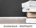 Small photo of School books on desk and calk bord background, education concept