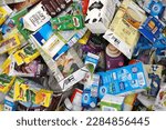 Small photo of PENANG, MALAYSIA - 2 APR 2023: Various beverage paper box waste in big bag at recycle center. Recycling is the process of converting waste materials into new materials and objects.